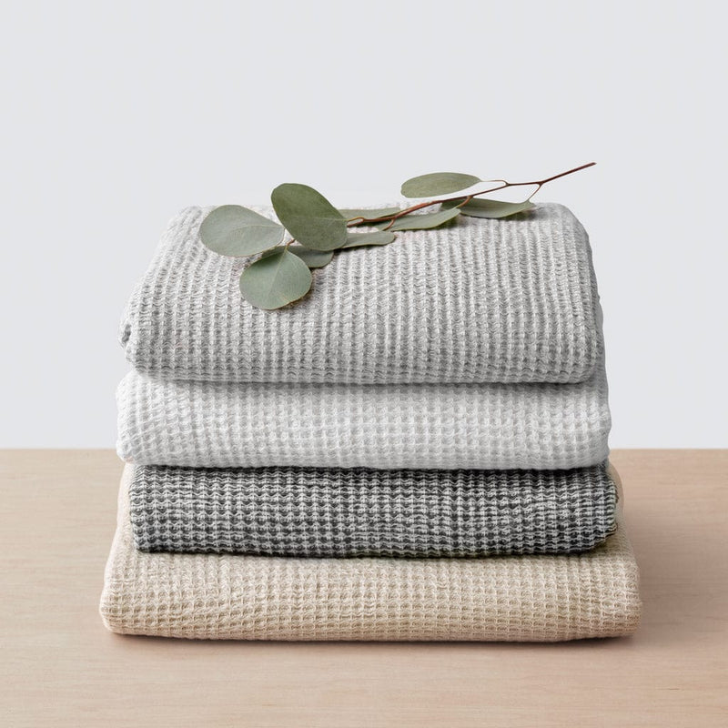 Stack of cotton waffle weave towels, tan