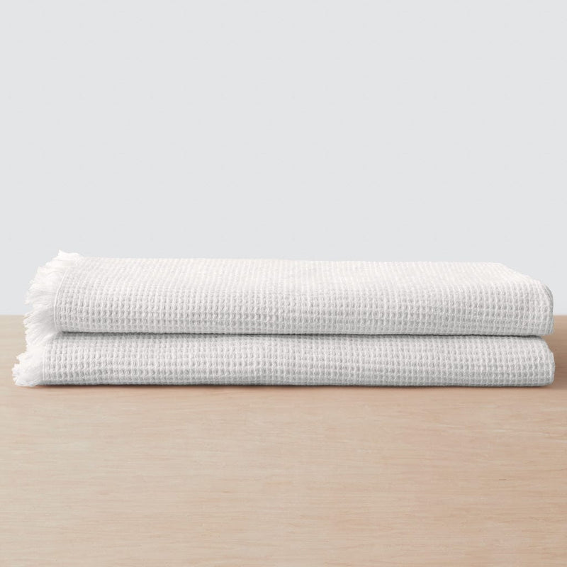 Stack of two waffle weave bath towels, white