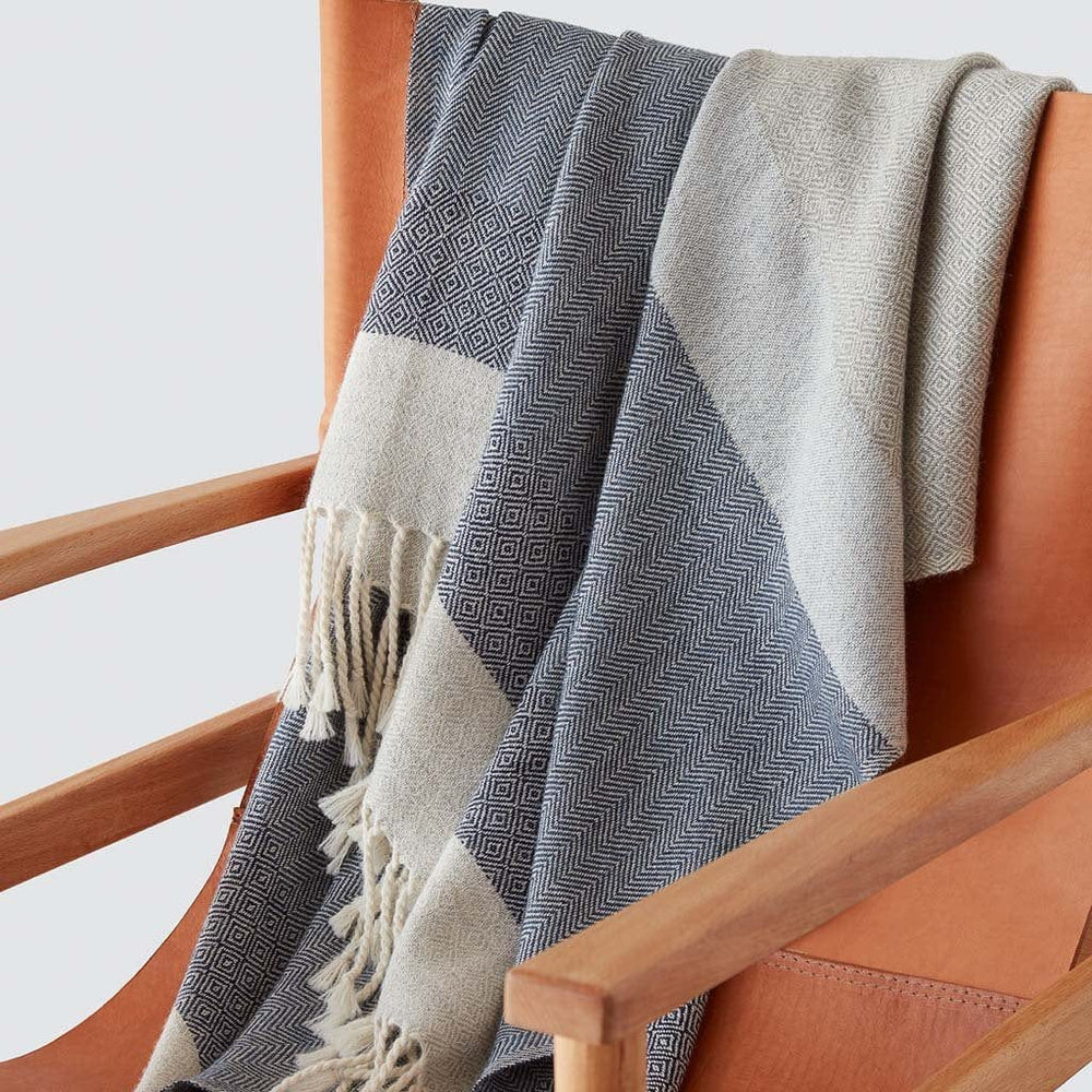 Blue Alpaca Blanket Draped over Leather Chair
