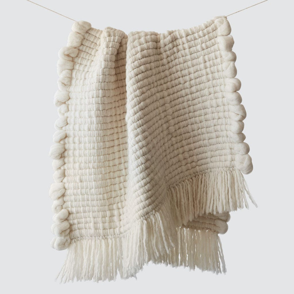 Chunky ivory wool throw with fringe