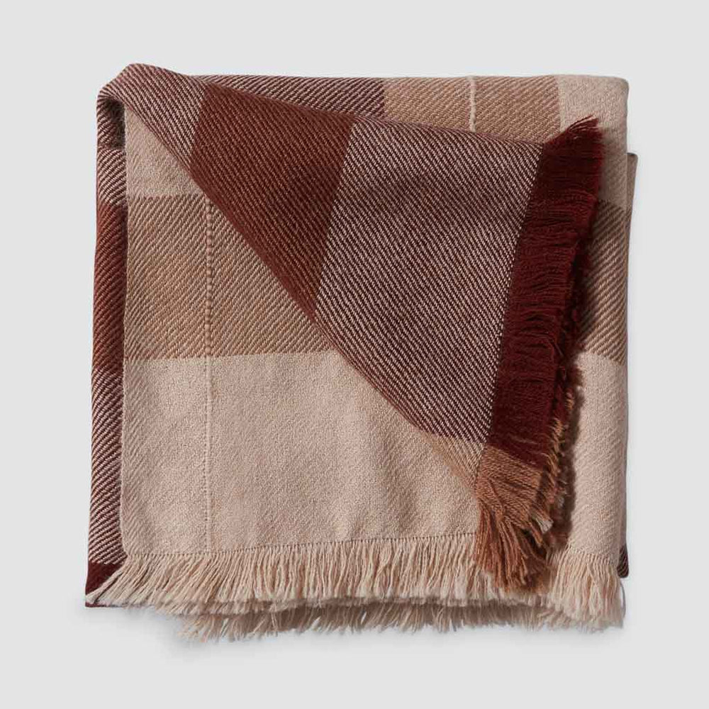folded alpaca throw with fringe, tan and rust