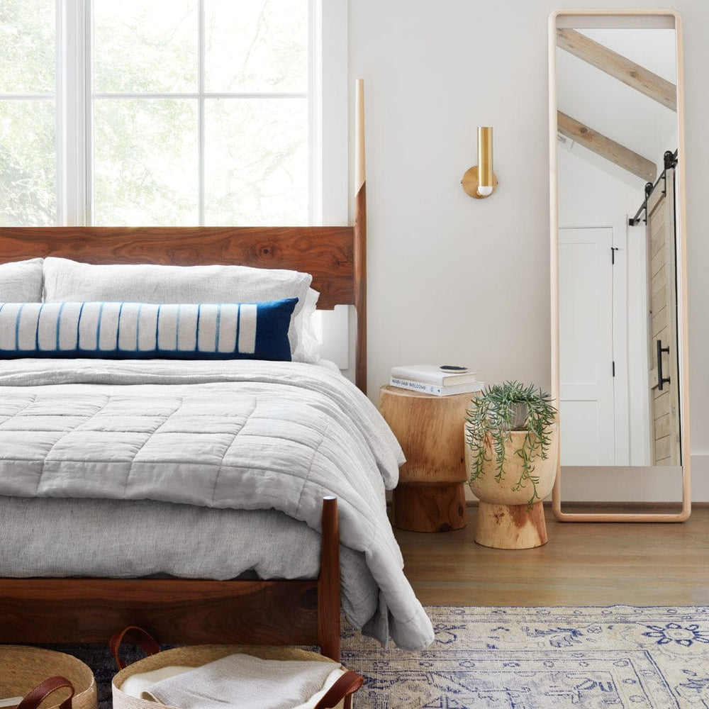 Indigo Lumbar Pillow on Modern Bed with Minimal Wood Mirror