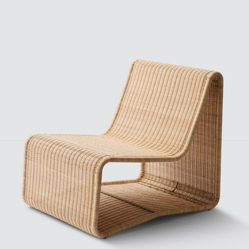 Side profile of Liang sculptural wicker lounge chair