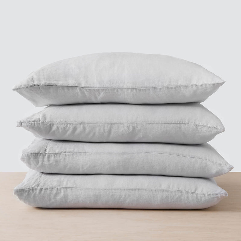 stack of four grey linen pillowcases, light-grey