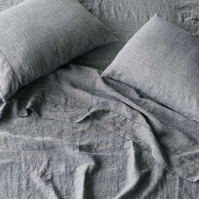 overhead of indigo chambray linen sheet set and pillowcases, indigo-chambray
