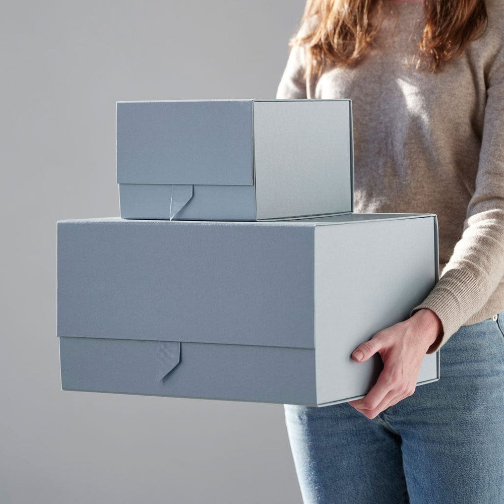 model holding gift boxes