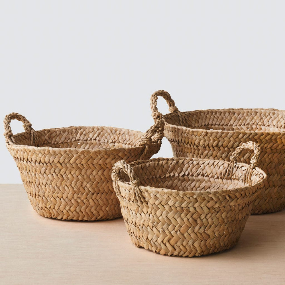 Trio of woven floor baskets