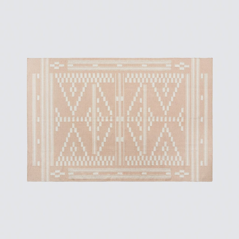 Overhead of patterned woven rug, rose