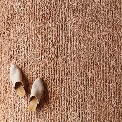 Detailed view of Suhana textured wool rug in multiple sizes, rose-clay