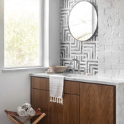 Modern bathroom with towel hanging over sink, stone-grey