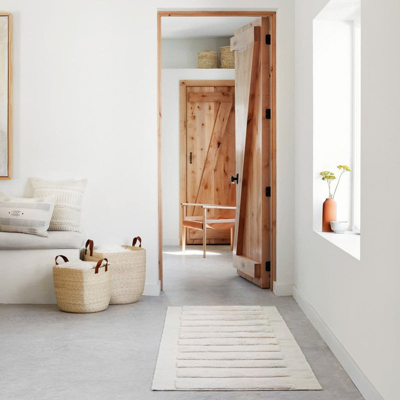 Textured Cream Runner Rug in Hallway with Baskets, sandstone