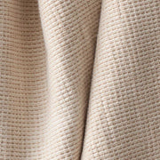 Detail of warm tan cotton spa towel, tan