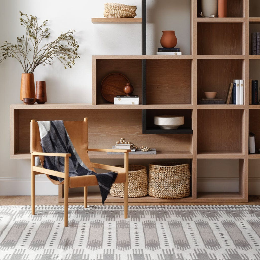 Large Grey Kilim Rug in Modern Room with Shelves and Seating