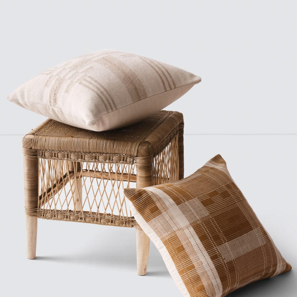 Woven Stool styled with throw pillows