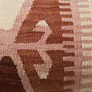 Detailed view of weaving on kilim lumbar pillow,sienna