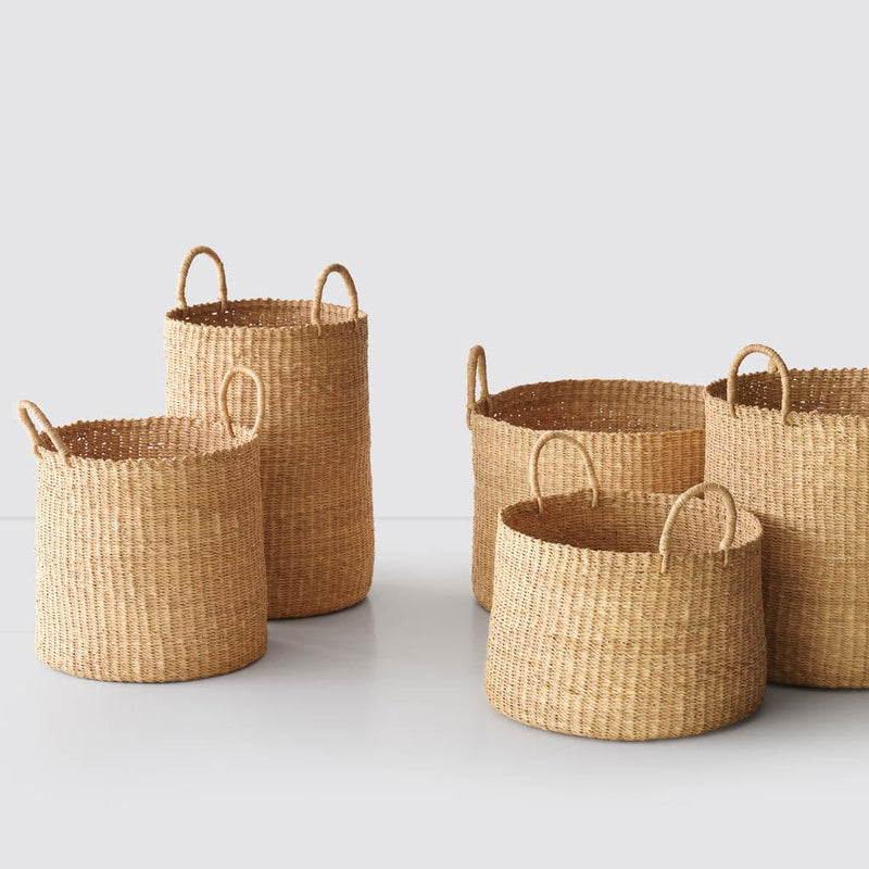 Handwoven Baskets in Natural Materials styled with multiple baskets, natural