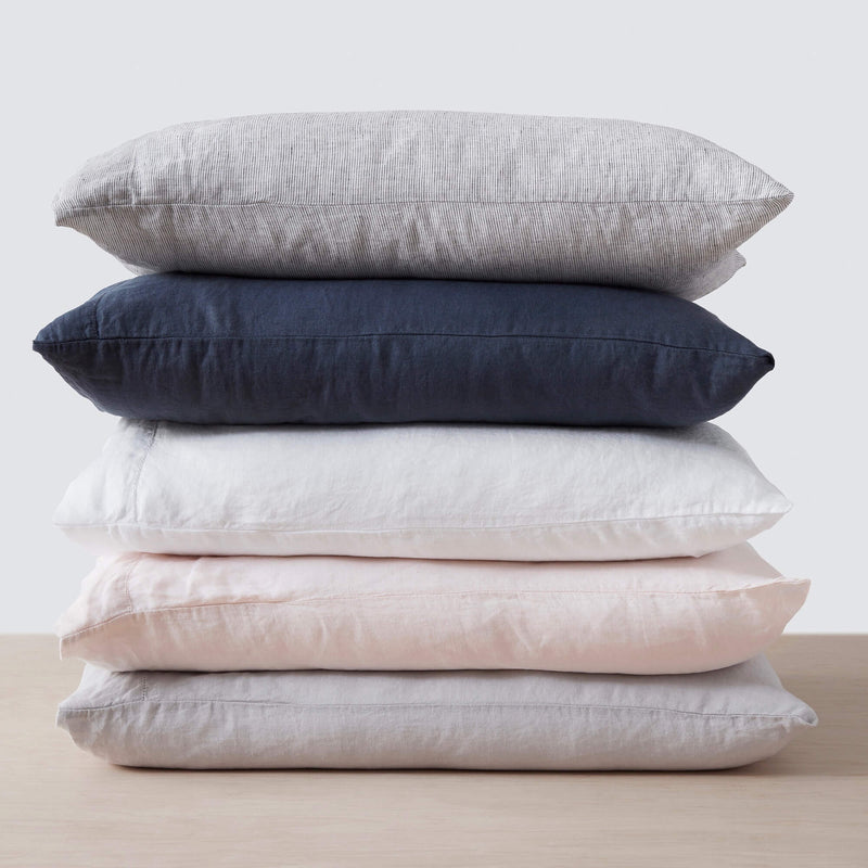 Stack of Linen Pillowcases from The Citizenry, graphite-thin-stripe