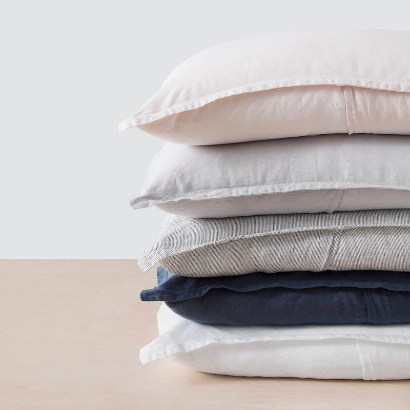 stack of various colored pillows, graphite-thin-stripe