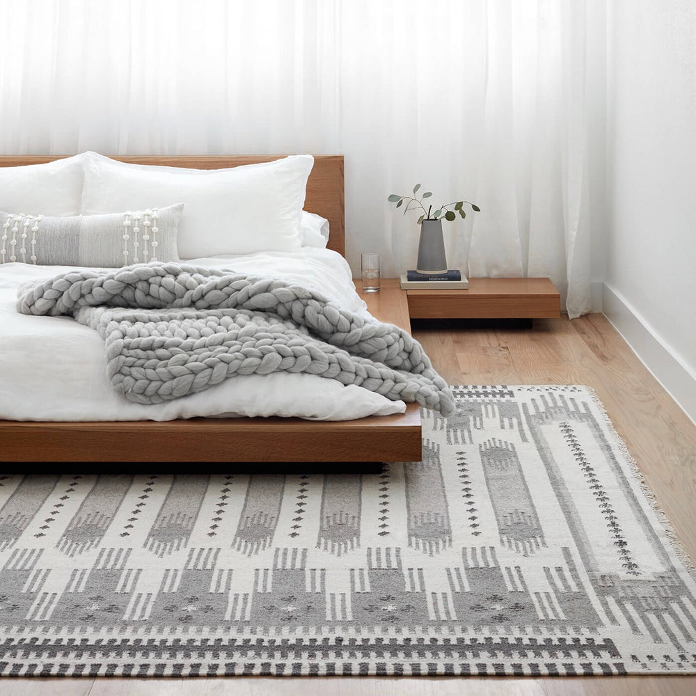 Large Grey Kilim Rug in Modern Bedroom with Chunky Throw