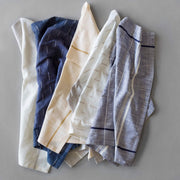 various napkins styled together, tan