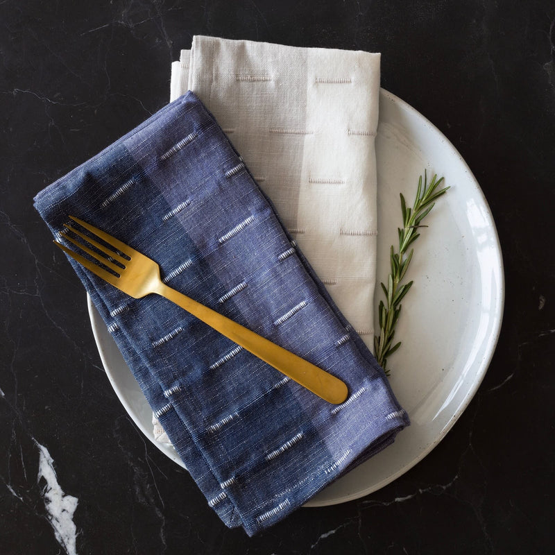 napkin styled on plate, blue