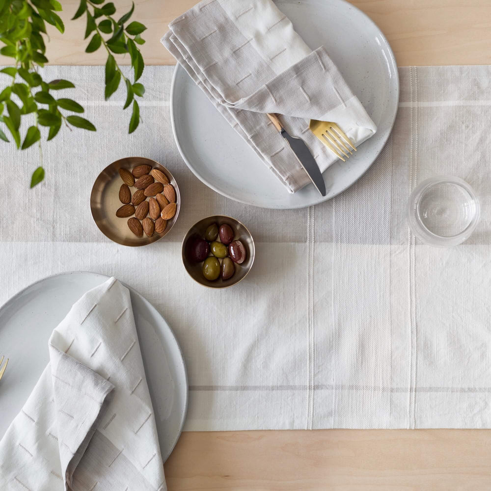 napkins styled with runner, tan