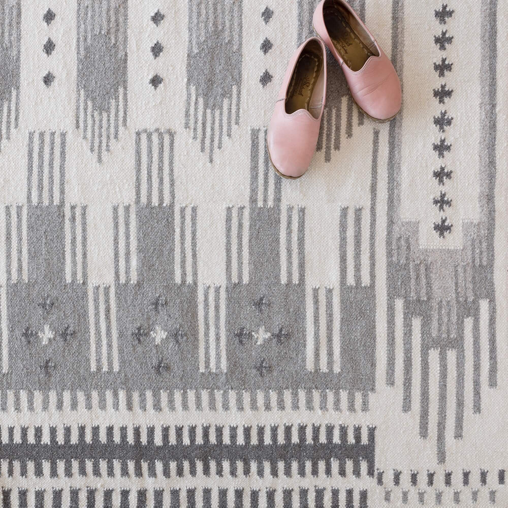Overhead Shot of Modern Grey Rug and Pink Shoes