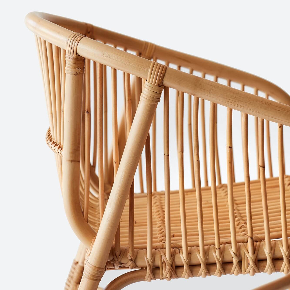 Side detail of rattan dining chair