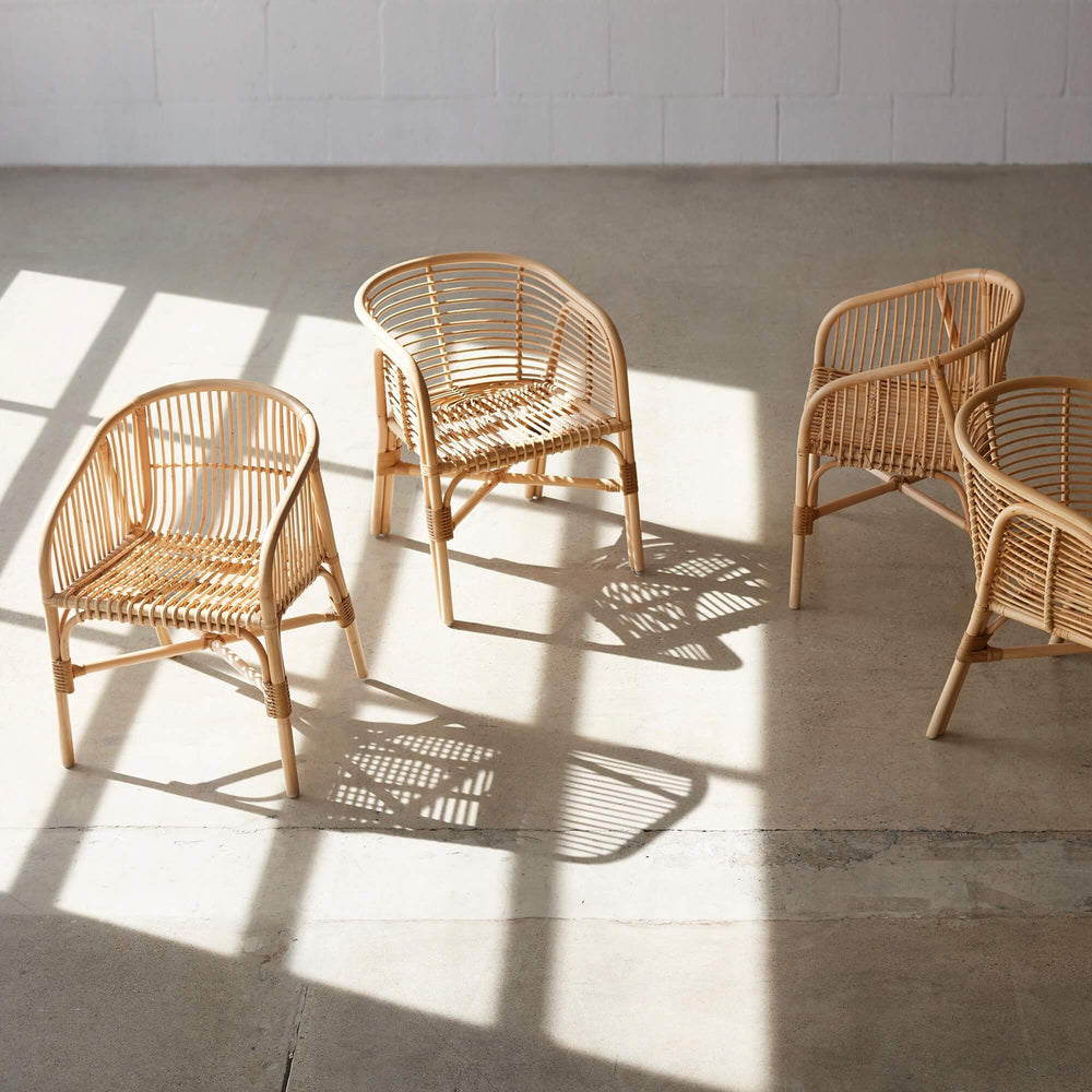 Multiple rattan dining chairs
