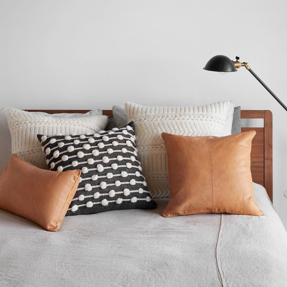 Bed Styled with Leather and Textured Wool Pillows