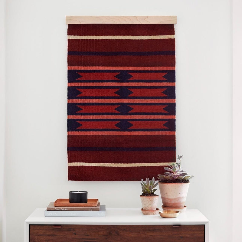 Styled Vignette with Maroon and Navy Wall Hanging, rust