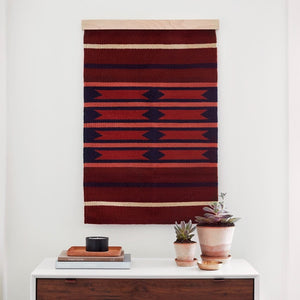 Styled Vignette with Maroon and Navy Wall Hanging, rust