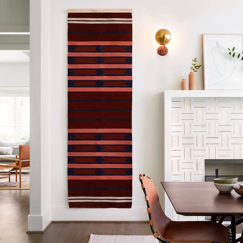 Long Striped Wall Hanging by Fireplace, rust
