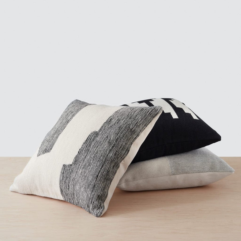 Neutral Modern Decorative Pillow styled with throws, black and cream