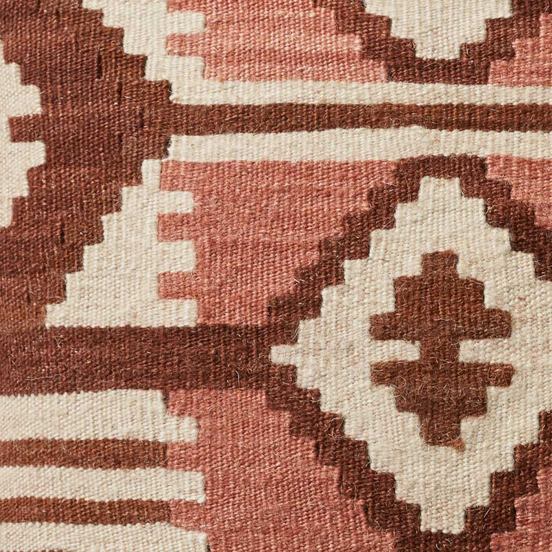 Pattern detail on blush and sienna kilim throw pillow,sienna