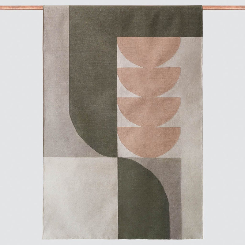 Abstract woven rug in olive and blush and tan hues, olive