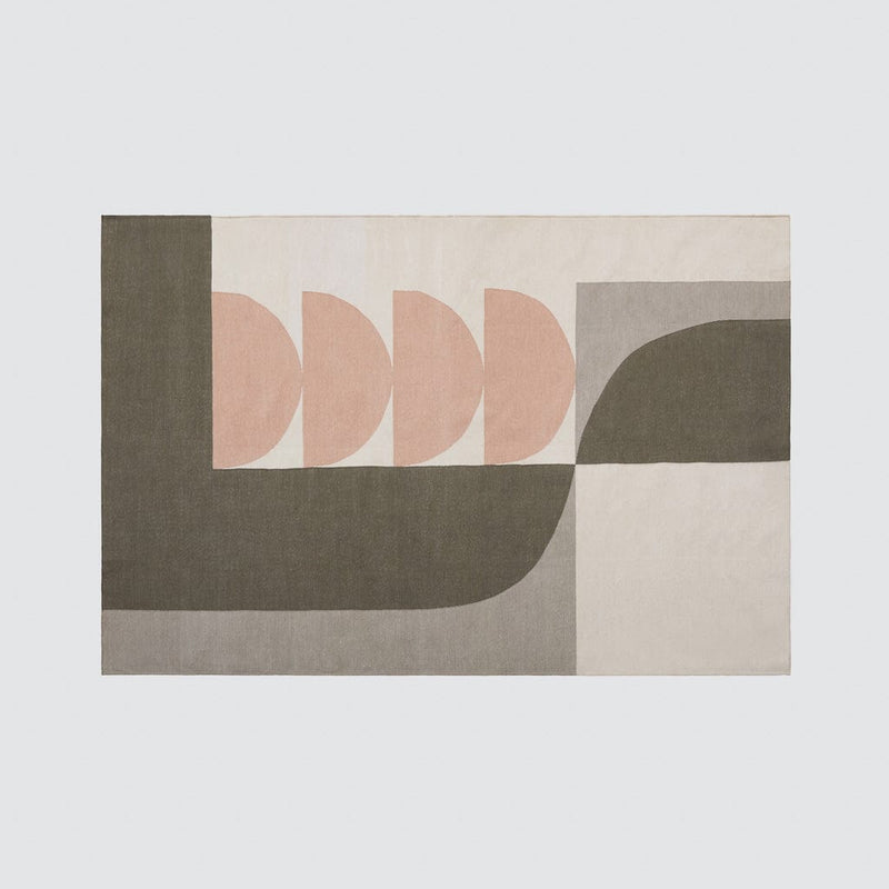 Overhead of woven abstract area rug, olive