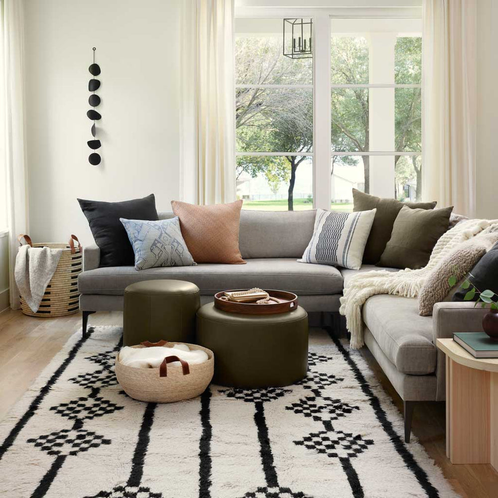 Modern Living Room with Turkish Rugs and Olive Leather Ottomans