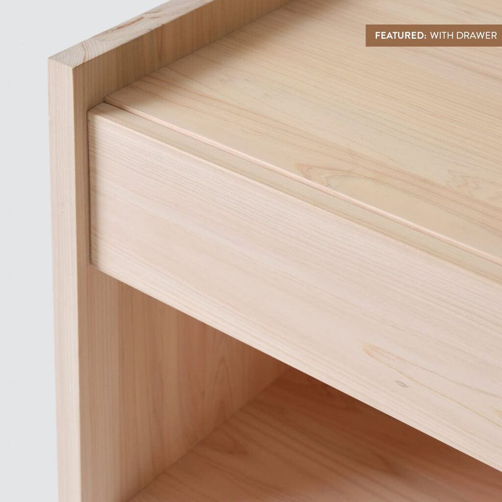 Front view of closed drawer of hinoki wood nightstand