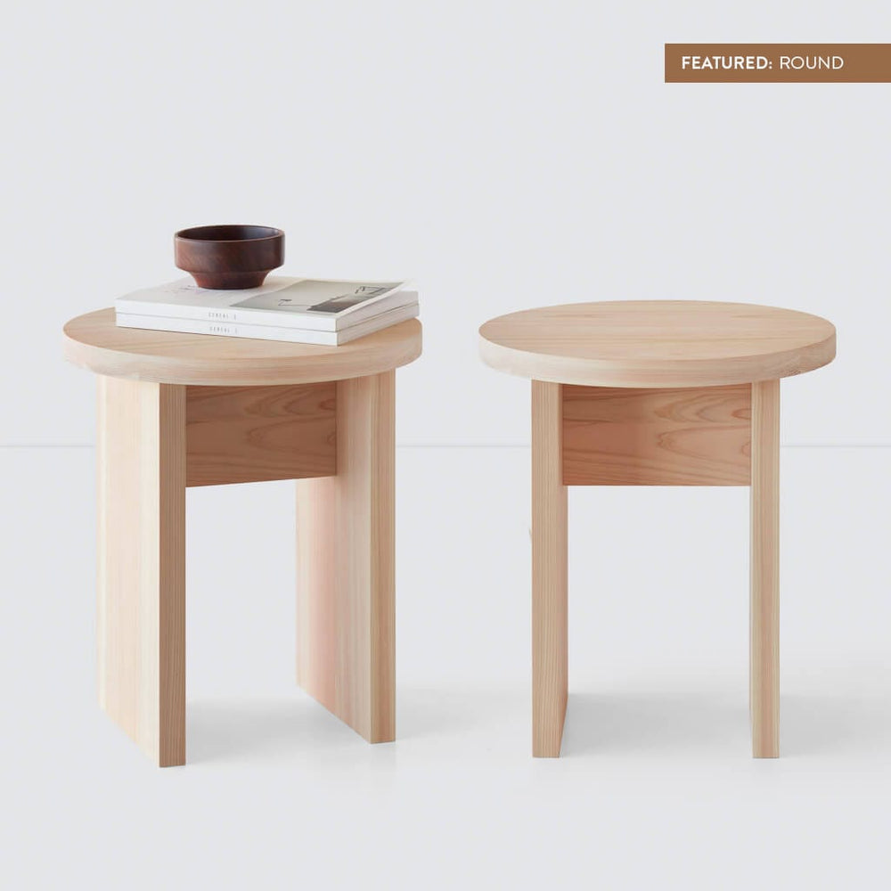 https://www.the-citizenry.com/cdn/shop/products/Hinoki_Wood_Side_Table_Round_14_With_Label_bb7d9b53-b7cf-4eb0-9671-5fe245e8f202.jpg?format=webp&v=1694549748&width=1000