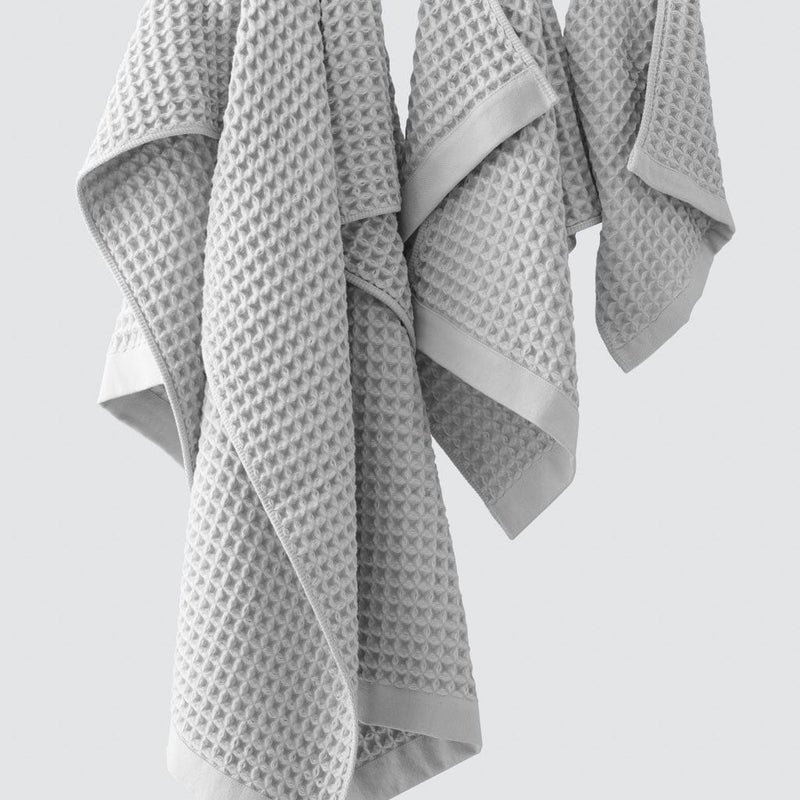 Soft grey waffle towels hanging, light-grey