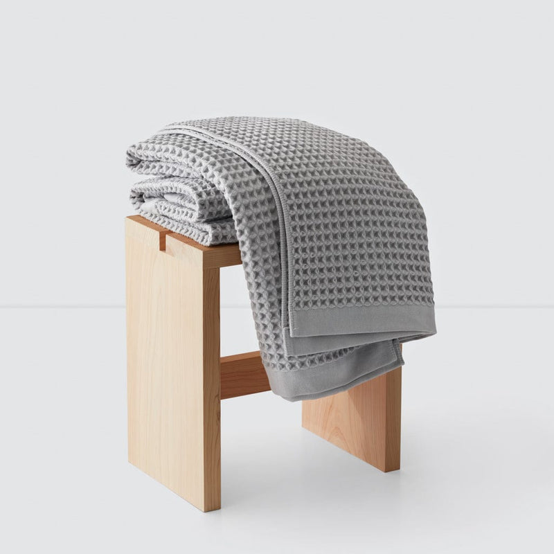 Folded waffle towels on Hinoki wood stool, light-grey