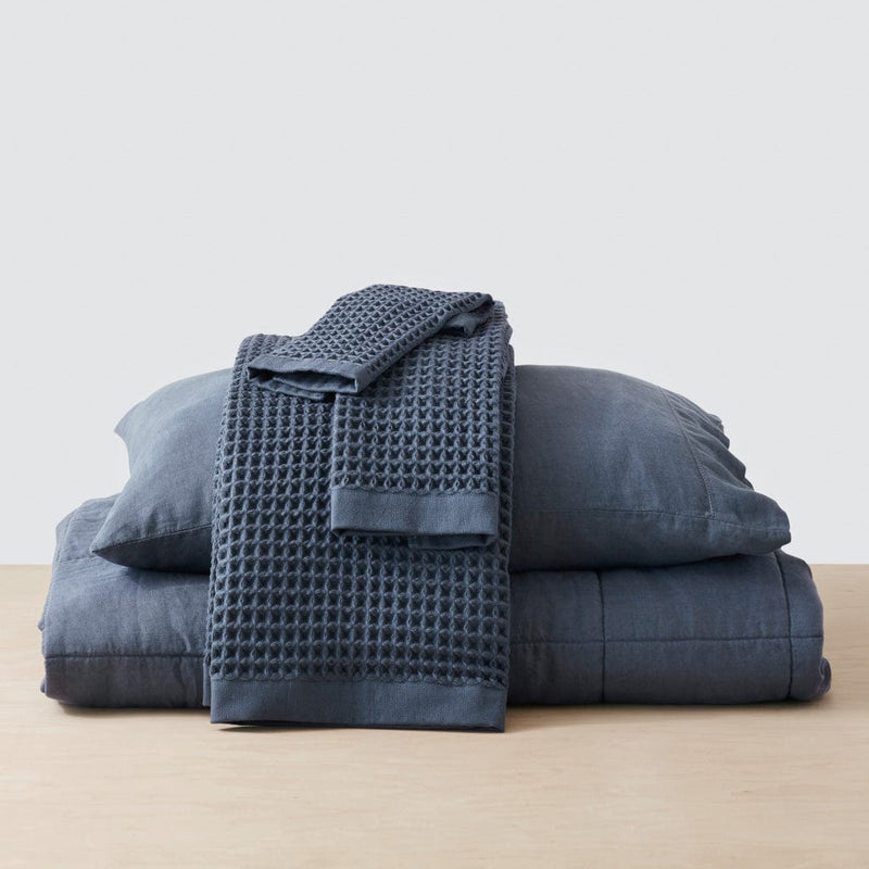 Navy waffle towels with matching linen bedding, indigo