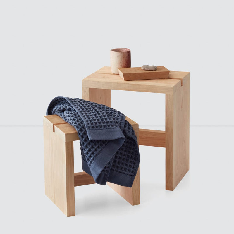 Waffle towel on wood bath stool, indigo