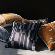 Wool textured pillow styled with other pillows, navy