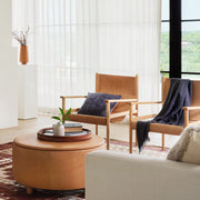 Wool textured pillow styled on leather chairs, navy