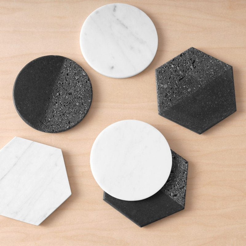 Overhead of mixed coaster set with black lava rock and white marble, mixed