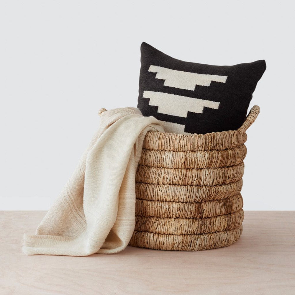 Handwoven Black Throw Pillow with Cream Design and Alpaca Throw in Handwoven Basket