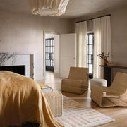 Liang sculptural wicker lounge chairs in bedroom
