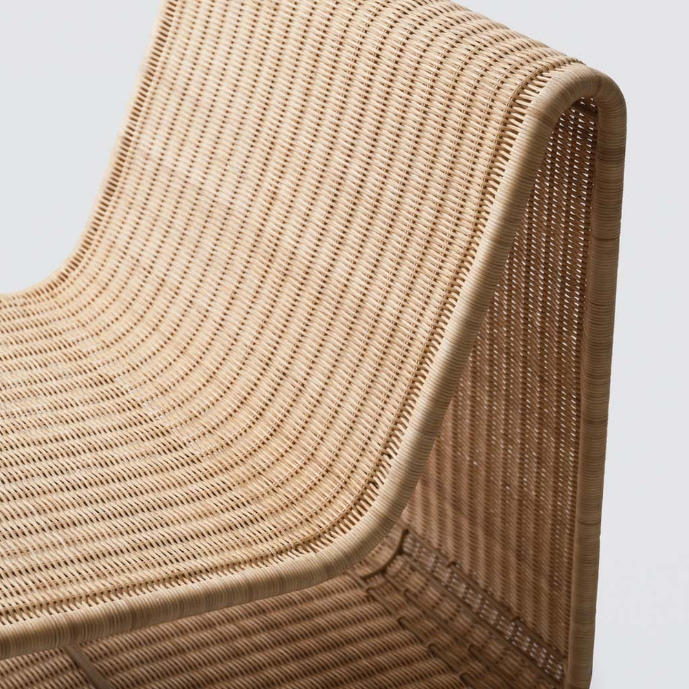 Tightly woven wicker on Liang modern lounge chair